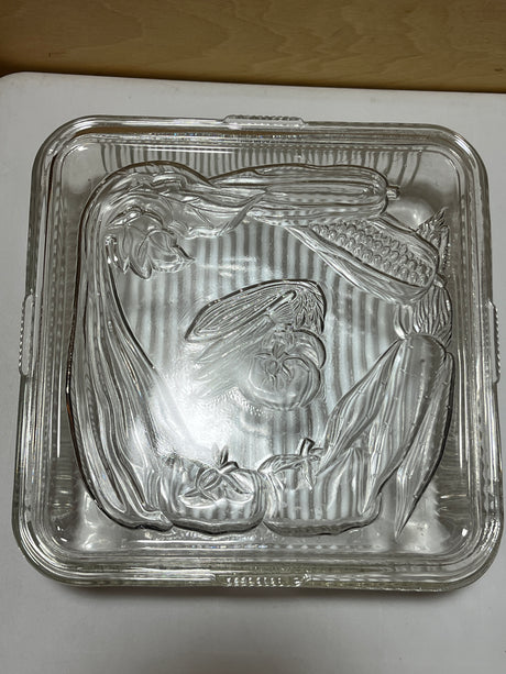 Antique Federal Glass square food container with lid embossed with produce illustrations and grooved sides for grip, from the 1940s.