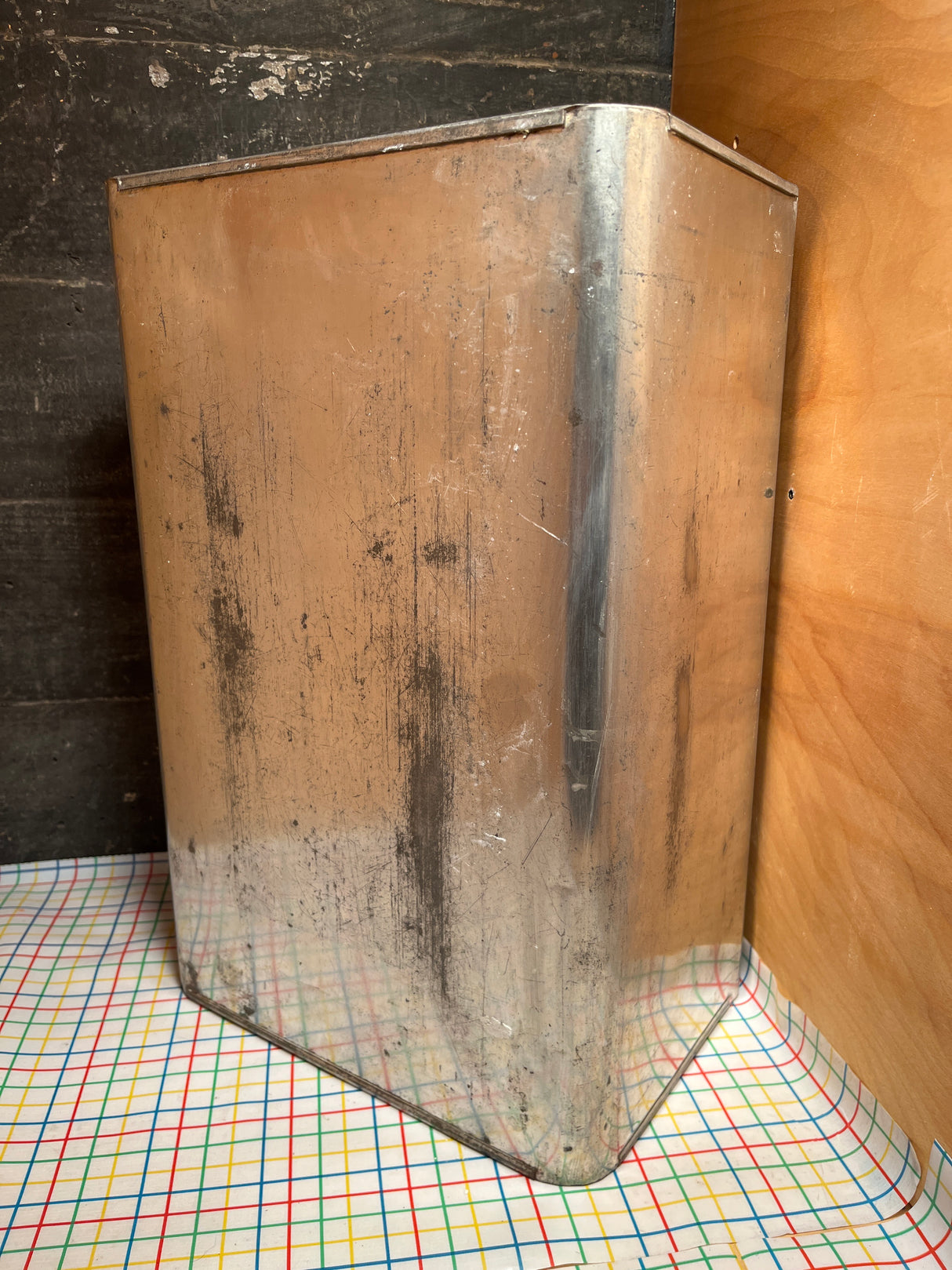 Antique steel bread box drawer insert with sliding lid, featuring two bent metal sheets, visible top flange, and original handmade labels; shows wear and scratches.