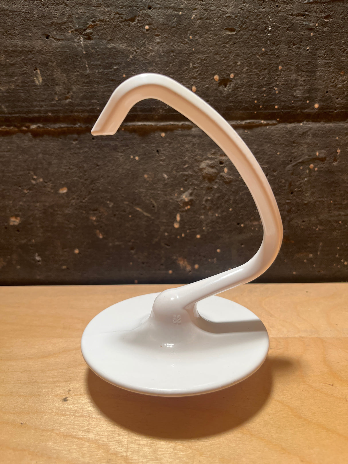 Dough hook attachment - Kitchenaid stand mixer, featuring a jewelry stand design with a round base for small items and an S-shaped arm for accessories.