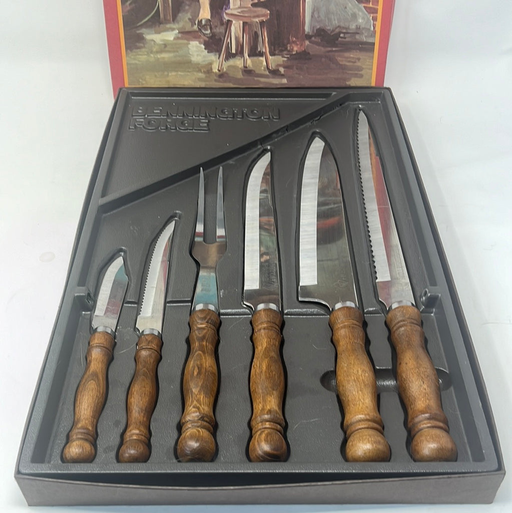 A set of sharp knives in a black box, including utility and chef's knives with round handles. Resharpened and comfortable for chopping. Original packaging included.