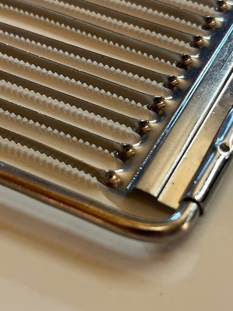 Serrated tomato/cheese slicer stainless steel with black handle