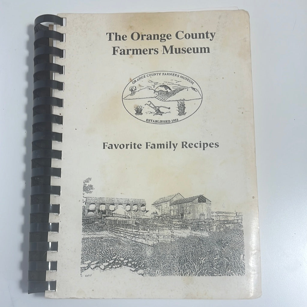 Front cover: A community cookbook featuring farm history and recipes from The Orange County Farmers Museum. From Spoons Kitchen Exchange.
