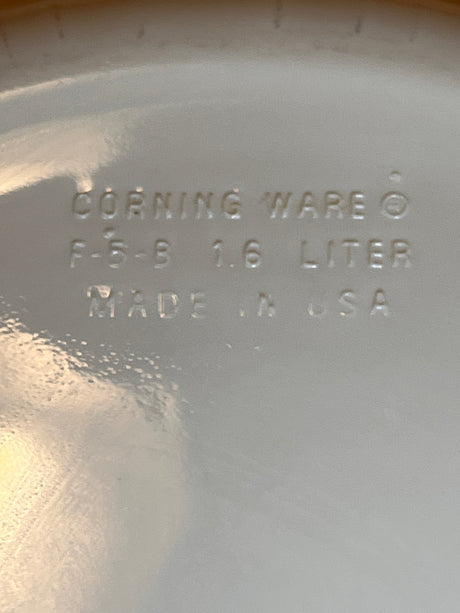 Corning Ware F-5-B 1.6L casserole dish underside, showing stamped details: CORNING WARE, model F-5-B, 1.6-liter capacity, MADE IN USA.