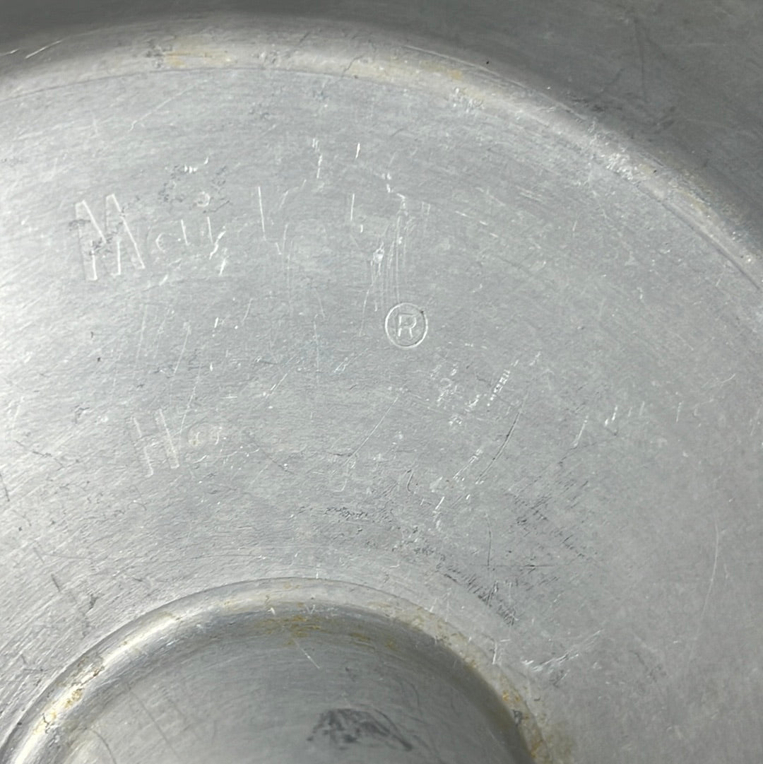 Close-up of a Maid of Honor Heavy Duty 1-Piece Angel Food Cake Pan with logo on metal surface. From Spoons Kitchen Exchange.