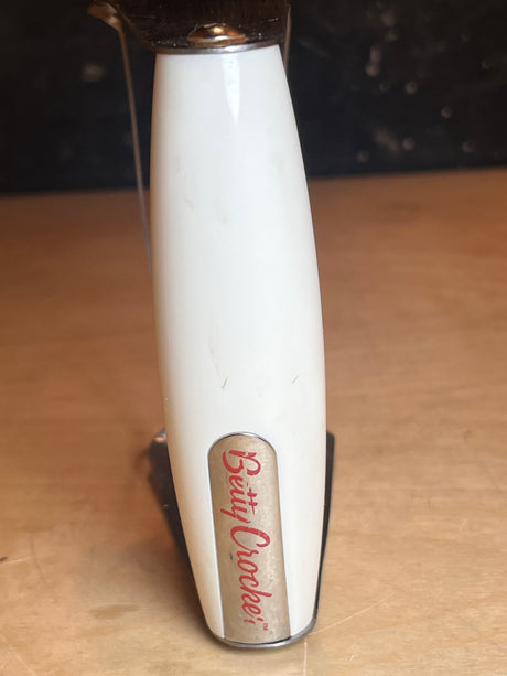 Betty Crocker Pastry blender featuring stainless steel blades and a white handle, ideal for blending cold butter into doughs for pastries and pies.