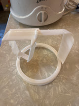 Automatic ice cream maker - Deni 5100's white plastic agitator with two fin-shaped paddles, visible against the appliance's main body with Off/I/On rocker switch.
