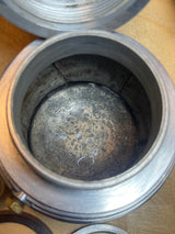 Close-up of the RARE Alessi Pulcina 6-cup moka pot, showcasing the interior corrosion and seam, with the gasket beside it.