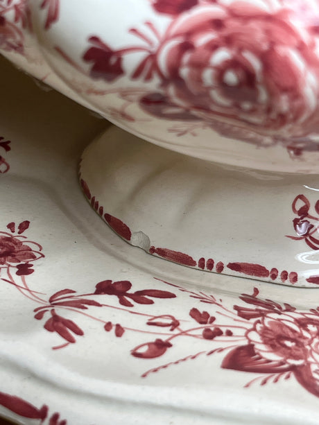 Porcelain soup tureen with lid and underplate, featuring hand-painted red roses. Includes a ladle and shows a small chip on the rim. Made in Italy.