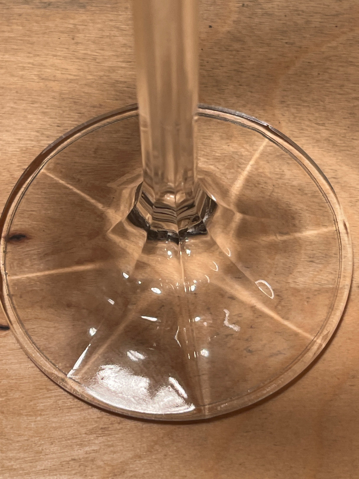 Crystal Water Goblet - Isabelle line by Bohemia Crystal-Crystalex, showcasing a multi-sided faceted stem and rounded bowl, crafted from lead crystal, resting on wood.