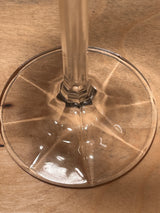 Crystal Water Goblet - Isabelle line by Bohemia Crystal-Crystalex, showcasing a multi-sided faceted stem and rounded bowl, crafted from lead crystal, resting on wood.