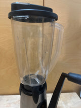 GSI Outdoors Vortex hand-cranked blender with a clear shatterproof Lexan jug, two-speed gear system on a sturdy base, and a vice clamp for stability.