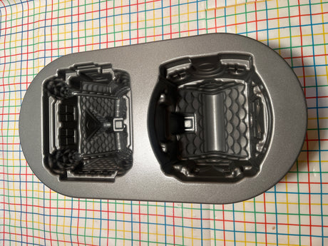 Gingerbread House Duet cast aluminum baking pan mold by Nordicware, featuring two detailed castle cavities, ensures even baking and easy release with a nonstick, PFAS-free finish.