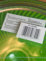 Easy Pull Salad Spinner by Prep Solutions, featuring a translucent green bowl with basket insert, shrink-wrapped, includes care instructions and price tag barcode, ideal for quick salad preparation.