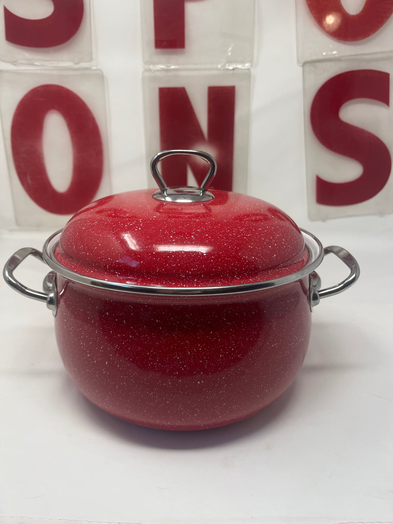 Crofton 4 Quart Red Casserole Stockpot with Lid featuring a durable enamel and steel build, visible metal handle, and slight interior scratches from use.