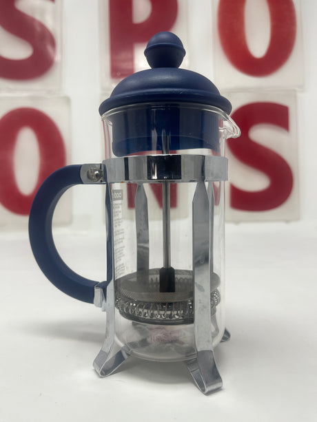 Bodum single serve French press coffee maker with glass body and navy handles, featuring a compact design ideal for one serving of coffee.