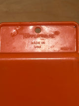 Orange pantry scoop - vintage plastic Tupperware, featuring Tupperware logo and “MADE IN USA,” perfect for scooping pantry essentials, with some scuffs on the handle.