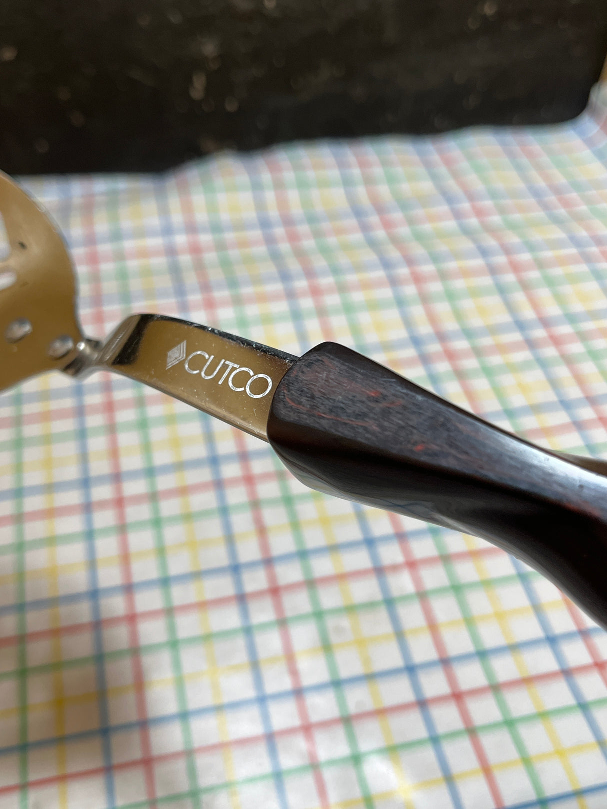 Slotted spoon - stainless steel with dark brown marbled resin handle - Cutco