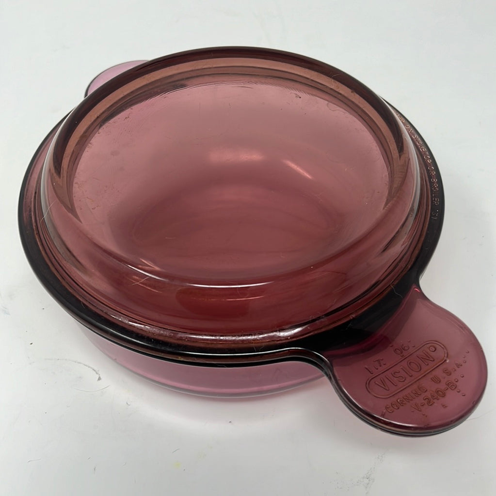 Cranberry Vision Ware pots with glass container, handle, and red plastic cap.
