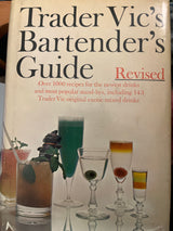 Trader Vic’s Bartender’s Guide (Revised 1972) cover featuring cocktail glasses and promises over 1000 updated drink recipes, including 143 Trader Vic originals.