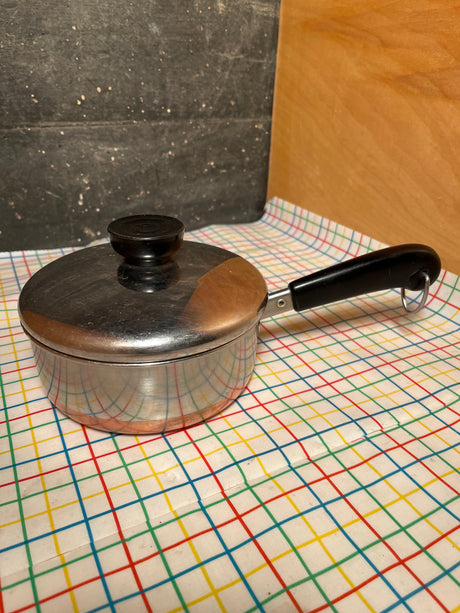 3/4-qt saucepan with copper bottom - vintage Revere Ware, stainless steel, domed lid, black Bakelite handle with ring, ideal for sauces or reheating.