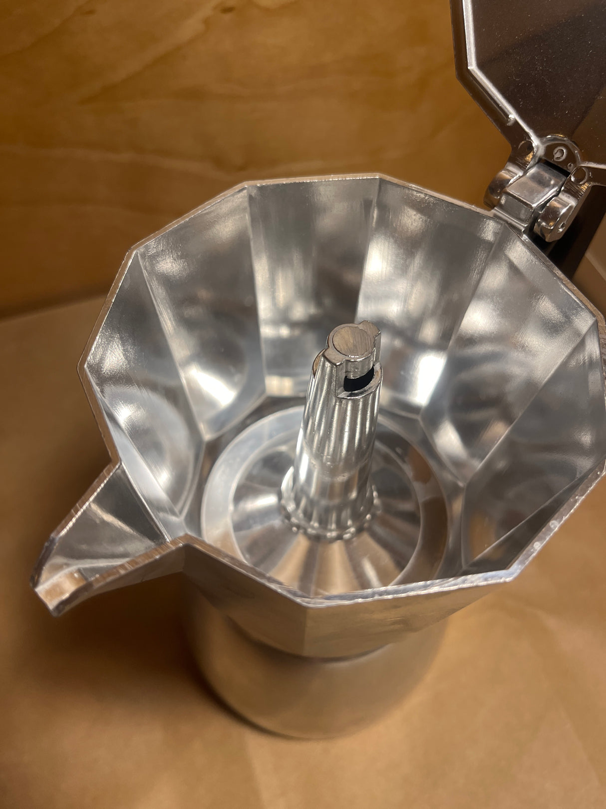 Interior view of La Cafetière Venice Aluminium 6-cup moka pot, showcasing the empty upper chamber and central funnel, highlighting its classic espresso-making design.