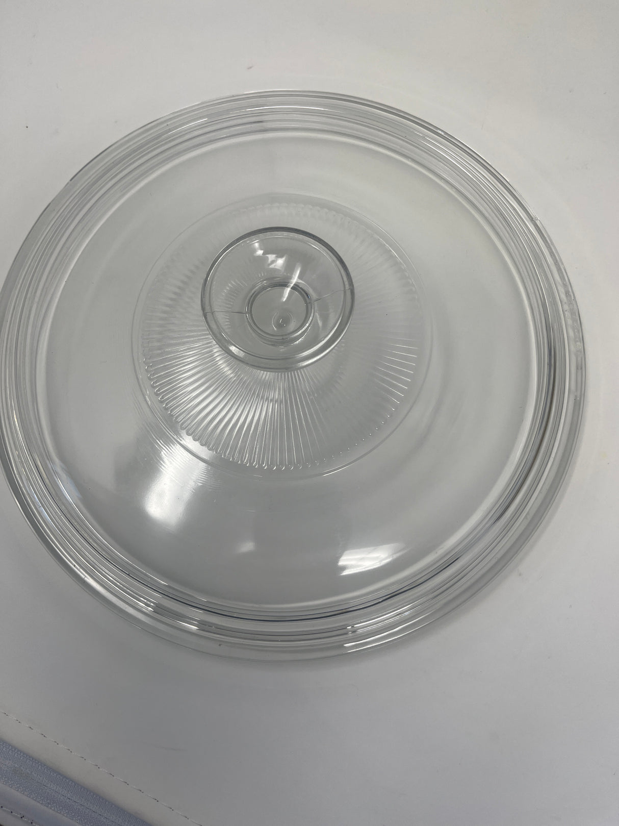 A versatile stainless steel sauté pan with a clear glass lid, ideal for heating smaller portions of food. Glass lid shown on a round base.