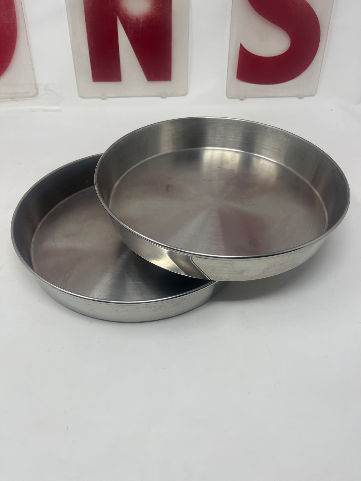 RARE Vintage West Bend Stainless Steel Round Baking Pans - Set of 2, featuring durable metal construction, ideal for even baking results.