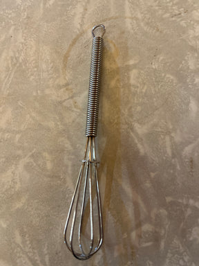 Mini whisk - stainless steel 4.5, ideal for mixing small portions. Features a spring-wrapped handle and classic wire-loop design for beating eggs or stirring sauces.
