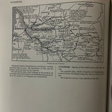 The World Authority The New Larousse Gastronomique book page showing a detailed map alongside culinary information, reflecting its comprehensive and encyclopedic nature.