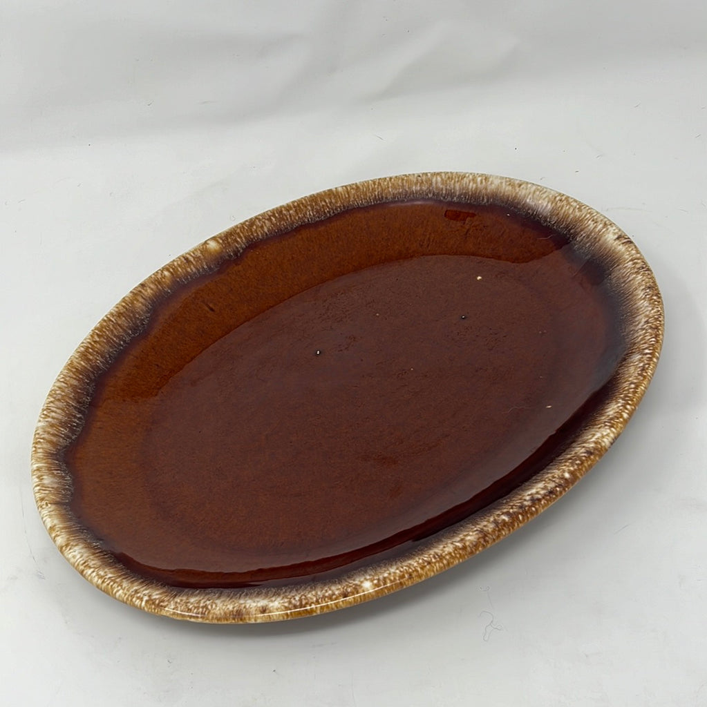 Oval baking dish with classic pottery pattern, Hull Oven-Proof Brown Oval Plate. From Spoons Kitchen Exchange.