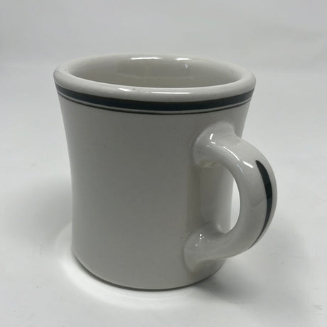 Victor coffee mug made of white ironware with a handle, featuring olive green accents on the rim, originally designed for U.S. military use.