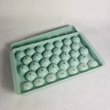 Wibimen turquoise mini sphere ice cube tray set on a white background.