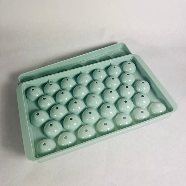 Wibimen turquoise mini sphere ice cube tray set on a white background.