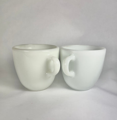 Vintage Pyrex 723-5 Tableware Corning Milk Glass Mugs, two matching mugs with a small chip, in good condition.