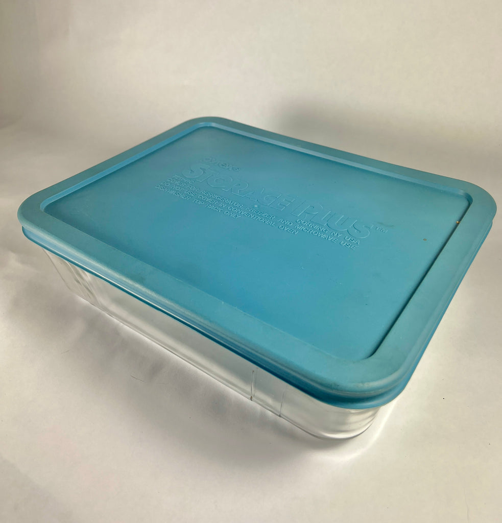 Pyrex Storage Plus baking dish with blue lid, clear container, and text label.