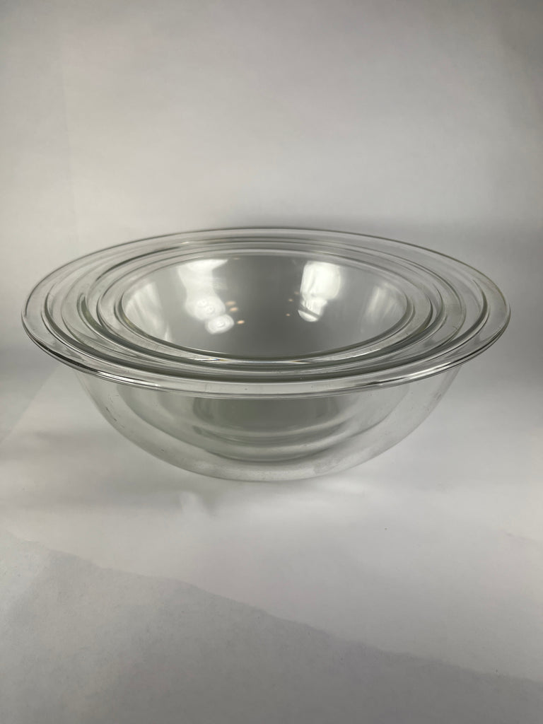 Pyrex mixing bowl stacking set, a clear glass bowl with a lid and ring, perfect for cooking and baking.