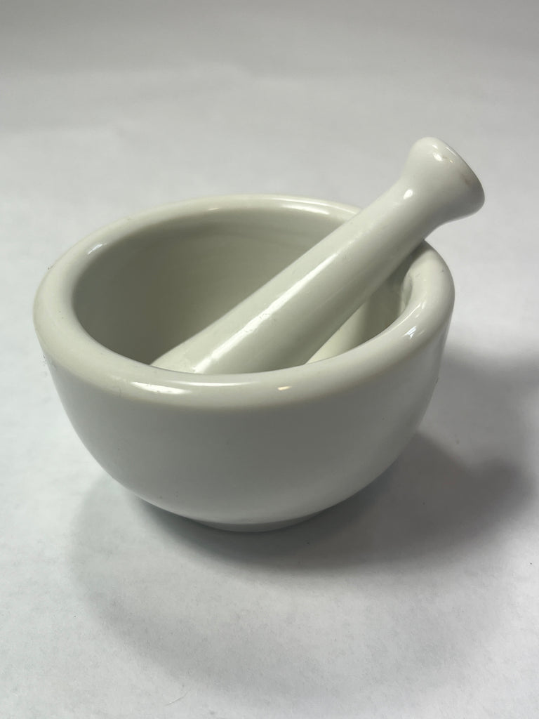 A small ceramic mortar and pestle set for apothecary needs. From Spoons Kitchen Exchange. 