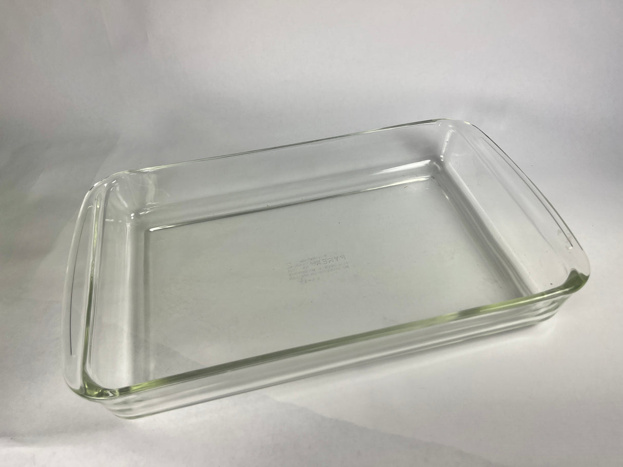 Pyrex baking dish, clear glass, suitable for various baking needs, shown on a plain surface.